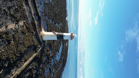 Rosses-Point-Lighthouse-vertical-Aerial-shot-tracking-out