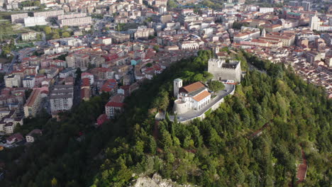 Medium-aerial-orbiting-left-shot-of-Monforte-Castle-in-Campobasso-with-city-in-the-background