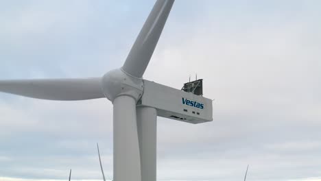 Close-up-of-a-wind-turbine-with-its-blades-rotating-at-an-european-wind-farm