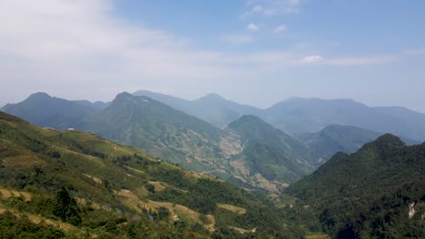 Aerial-Flying-Over-Tourists-Standing-On-Hilltop-Overlooking-Sapa-Valley-In-Vietnam