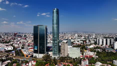 Aerial-view-around-the-torre-Mitikah-complex,-in-sunny-Benito-Juarez,-Mexico