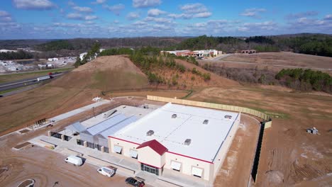 Aerial-fly-over-of-newly-constructed-Tractor-Supply-storefront-in-Pelham,-Alabama