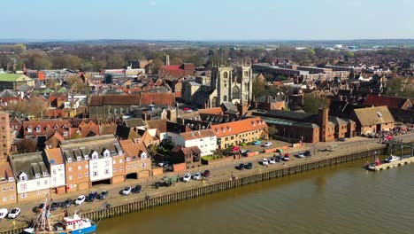 Aerial-view-of-Kings-Lynn-riverfront,-fishing-trawler-and-the-River-Great-Ouse,-Kings-Lynn,-Norfolk,-UK