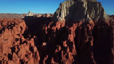 Aerial-flight-over-hikers-in-Goblin-Valley-State-Park-in-Utah