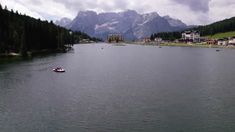 Aerial-view-of-tourist-boat-on-lake-Misurina-in-Dolomites-mountain