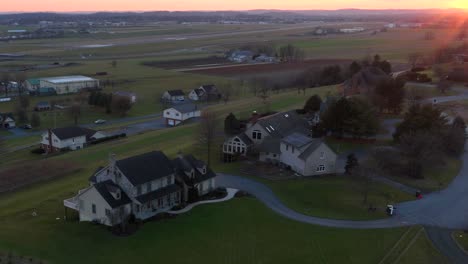 Aerial-hyperlapse-of-luxury-house-in-rich-neighborhood-during-winter-sunset