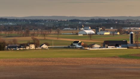 Long-aerial-panning-zoom-of-Amish-farm-and-home