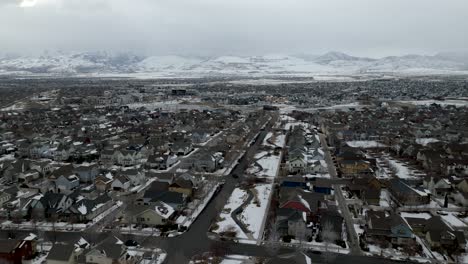 Daybreak-South-Jordan,-Utah-mater-planned-community-in-winter---aerial-flyover