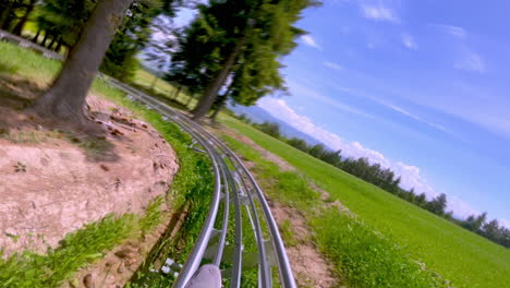 Alpine-coaster-ride-downhill,-Toplita-Romania