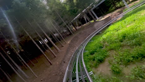 Alpine-coaster-ride-downhill,-Toplita-Romania