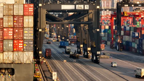 Shipping-Container-Terminal-During-Golden-Hour,-Parallax-Aerial-Establishing-Shot