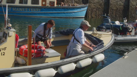 Wooden-Boat-With-Passengers-At-The-Harbour-Of-St-Mawes-Fishing-Village-In-Cornwall,-United-Kingdom