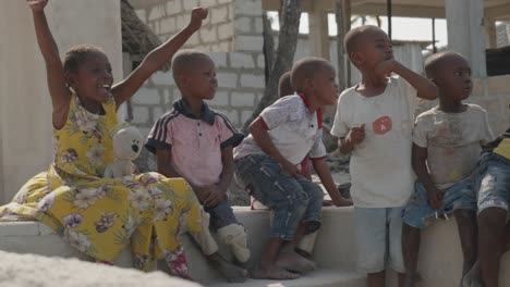 Group-of-young-black-African-children-smiling-and-having-fun-in-poverty