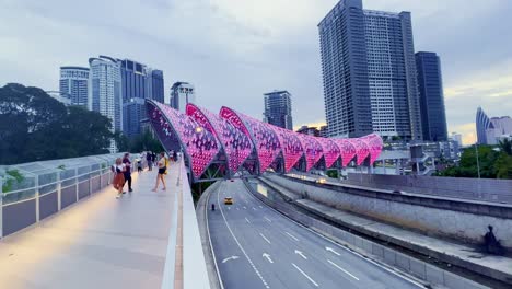 Kuala-Lumpur-,-kuala-Lumpur-,-Malaysia---:-Kuala-Lumpur,-Malaysia,-footage-of-a-pedestrian-bridge-named-Lintas-Saloma-bridge-near-Kuala-Lumpur-Petronas-Twin-Tower