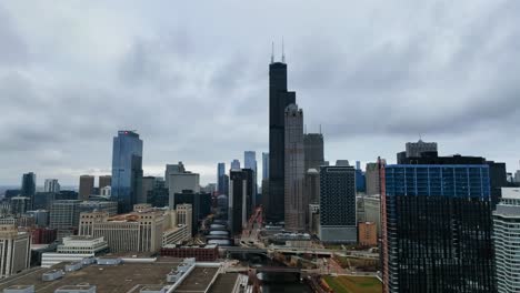 Aerial-view-of-the-Sears-tower-and-the-South-Loop-cityscape-in-cloudy-Chicago,-USA