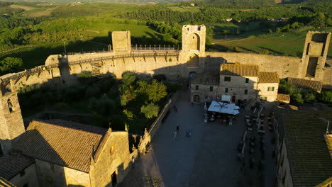 Monteriggioni-Comune-At-Sunset-In-Tuscany,-Italy---aerial-drone-shot