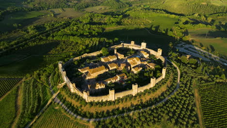 Aerial-View-Over-Monteriggioni-Comune-At-Sunset-In-Tuscany,-Italy---drone-shot
