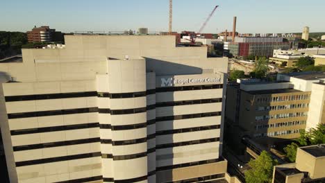 Cancer-Center-of-Michigan-University-complex,-aerial-fly-backward-view