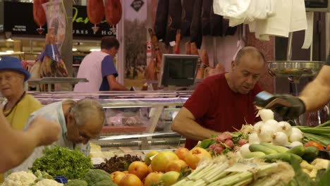 People-buying-fresh-vegetables-at-Spanish-Central-Valencia-Marketplace