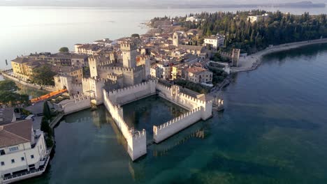 Aerial-view-Sirmione-italy,-peninsula-resort-town-on-lake-garda,-mediterranean-surroundings-historical-town-with-castle