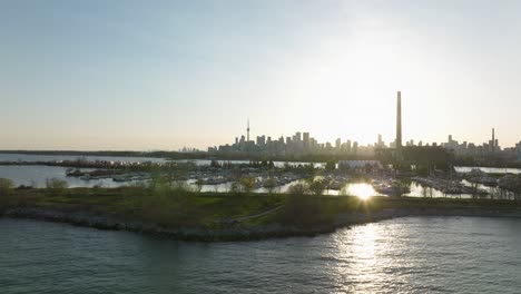 Tommy-Thompson-park-and-bay-in-Toronto,-Ontario,-Canada,-Distant-view-on-the-city,-distant-orbit