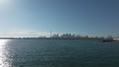 Toronto-from-a-drone,-Drone-flies-close-to-the-ground-level