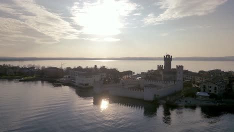 Aerial-view-Sirmione-italy,-peninsula-resort-town-on-lake-garda,-mediterranean-surroundings-historical-town-with-castle