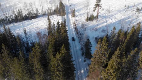 Car-driving-on-a-winter-road-in-Trysil,-Norway