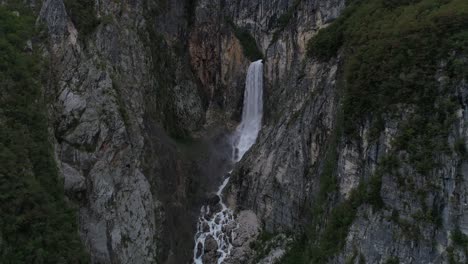 Aerial-Drone-Shot-of-a-big-Waterfall-in-Slovenia,-flying-backward,-4k-UHD