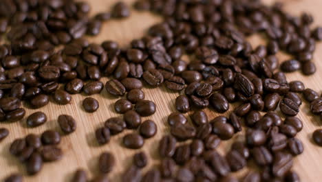 Pile-of-Coffee-Beans-on-Wooden-Surface-Slow-Fly-Over-02