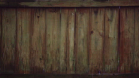 Steady-Rain-Falling-in-Front-of-Wooden-Fence---Super-Slow-Motion