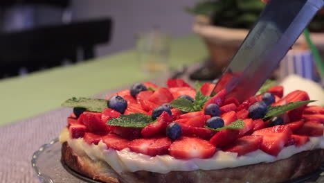 Close-Up-Of-Strawberry---Blueberry-Tart-Cutting,-Flavourful