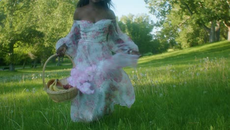 Black-Woman-on-picnic-in-park-running-to-low-angle-close