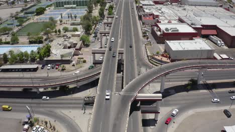 Aerial-shot-of-traffic-moving-in-small-town