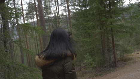Happy-girl-walking-in-the-forest