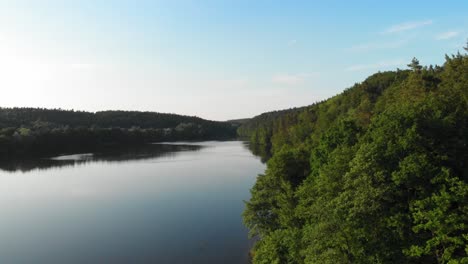 Łapino-lake-in-pomeranian-district-dolly-shot-from-a-drone