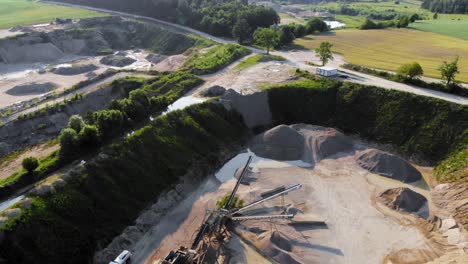 Aerial-tilt-shot-from-a-drone-of-quarry-and-heavy-machinery-in-pomeranian-district-in-Poland