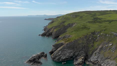 Beautiful-cliffs-on-a-green-rocky-mountain-by-the-Irish-blue-sea