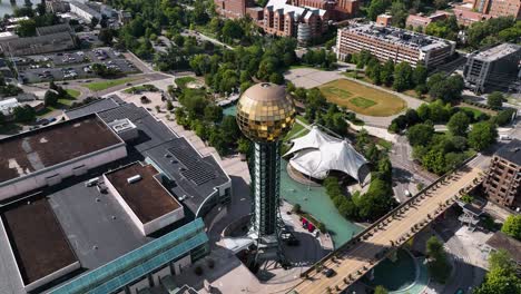 Aerial-view-circling-around-the-Sunsphere-tower,-in-sunny-Knoxville,-USA
