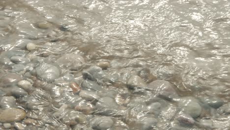 Water-splashing-over-stones-at-a-beach-30-seconds