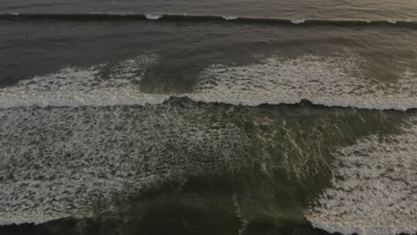 Waves-breaking,-aerial-view