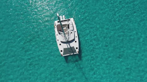 Aerial-View-of-the-White-Sailing-Catamaran-Yacht-in-summer