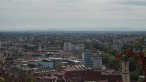 Panoramic-view-of-city-of-Graz-Austria,-static-shot,-hills-in-background