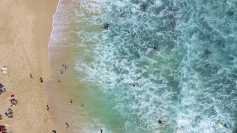 Top-view-of-tropical-beach-with-Blue-ocean-and-big-waves-foaming-and-crushing-on-beach