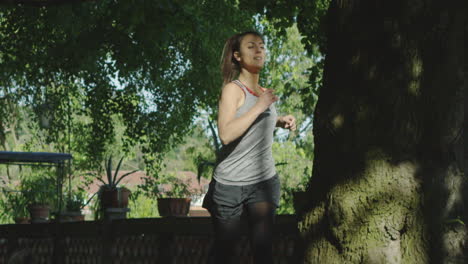 Young-woman-jogging-in-the-park-slow-motion