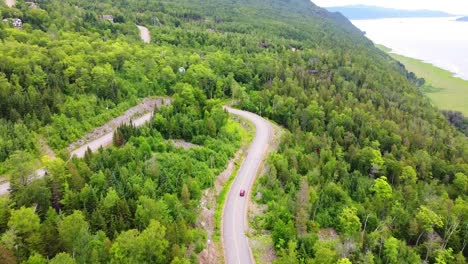 Aerial-footage-of-red-car-on-scenic-route