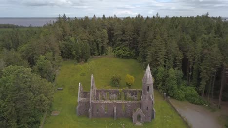 Reverse-reveal-aerial-shot-of-Tourmakeady-church