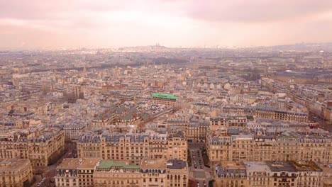 Flying-above-Paris-buildings-and-streets-with-Montparnasse-in-the-distance
