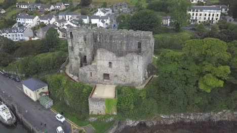 Reverse-reveal-drone-shot-of-King-John-castle-in-Carlingford,-Ireland,-Co