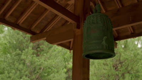 Temple-bell-moving-in-the-breeze,-medium-close-up